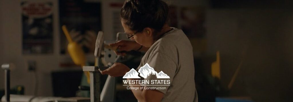 A person wearing safety glasses works with a hand tool on a metal object in a workshop. The logo for Western States College of Construction is centered in the foreground.