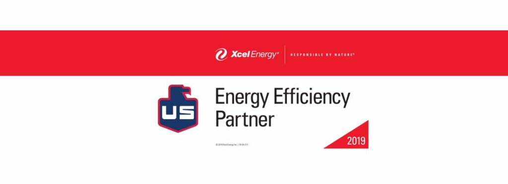 A banner with the Xcel Energy logo and tagline “Responsible by Nature” above the words “Energy Efficiency Partner.” A blue and red shield with “US” and a red triangle with “2019” are also visible.