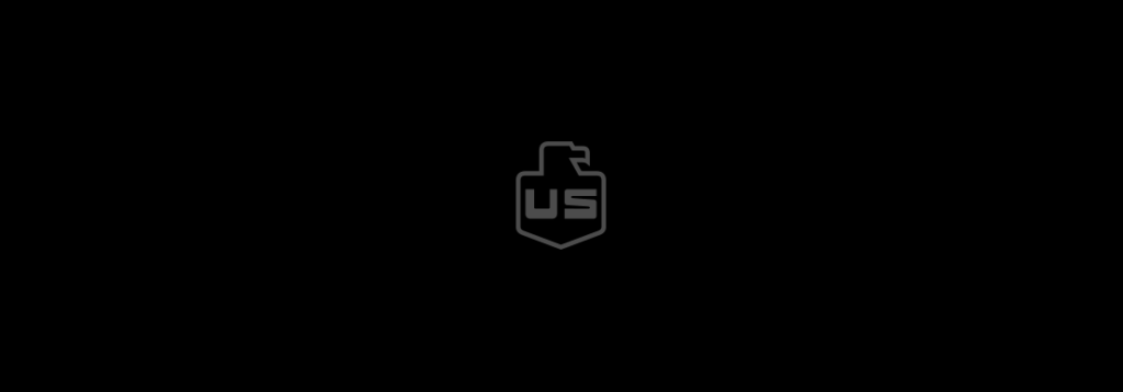 A simple black background with a gray outlined shield in the center, featuring the letters US inside and a stylized eagle head at the top of the shield.